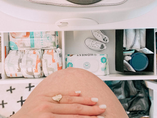 mother holding pregnant stomach