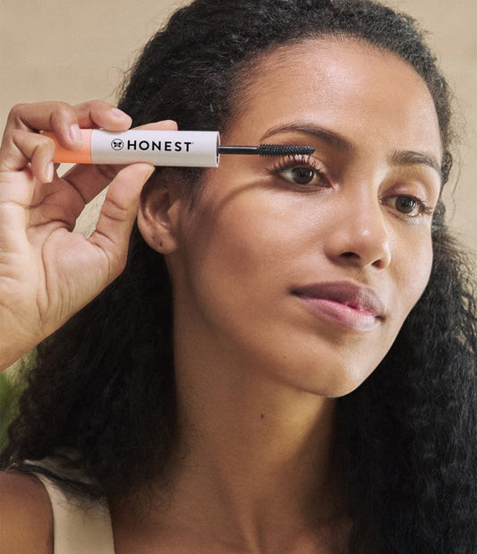 Women applying Honest Extreme Length Mascara