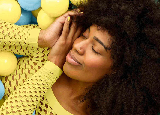 girl sleeping in ball pit