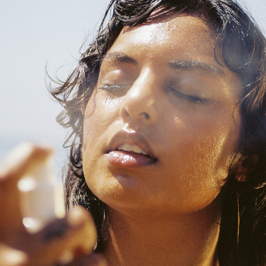 Woman spraying honest setting spray