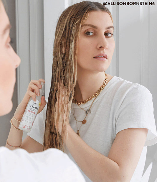 Woman using detangler