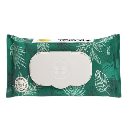 A package of Honest Naturals flushable wipes, featuring a green and white tropical leaf pattern with a large white flip-top window in the center.