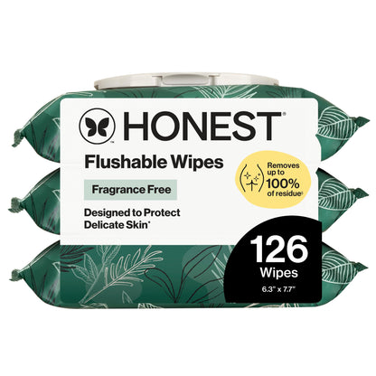 Three packs of Honest Flushable Wipes stacked together, featuring a white label with green botanical leaf patterns, a yellow '100% residue-free' badge, and a black '126 Wipes' callout on a white background.