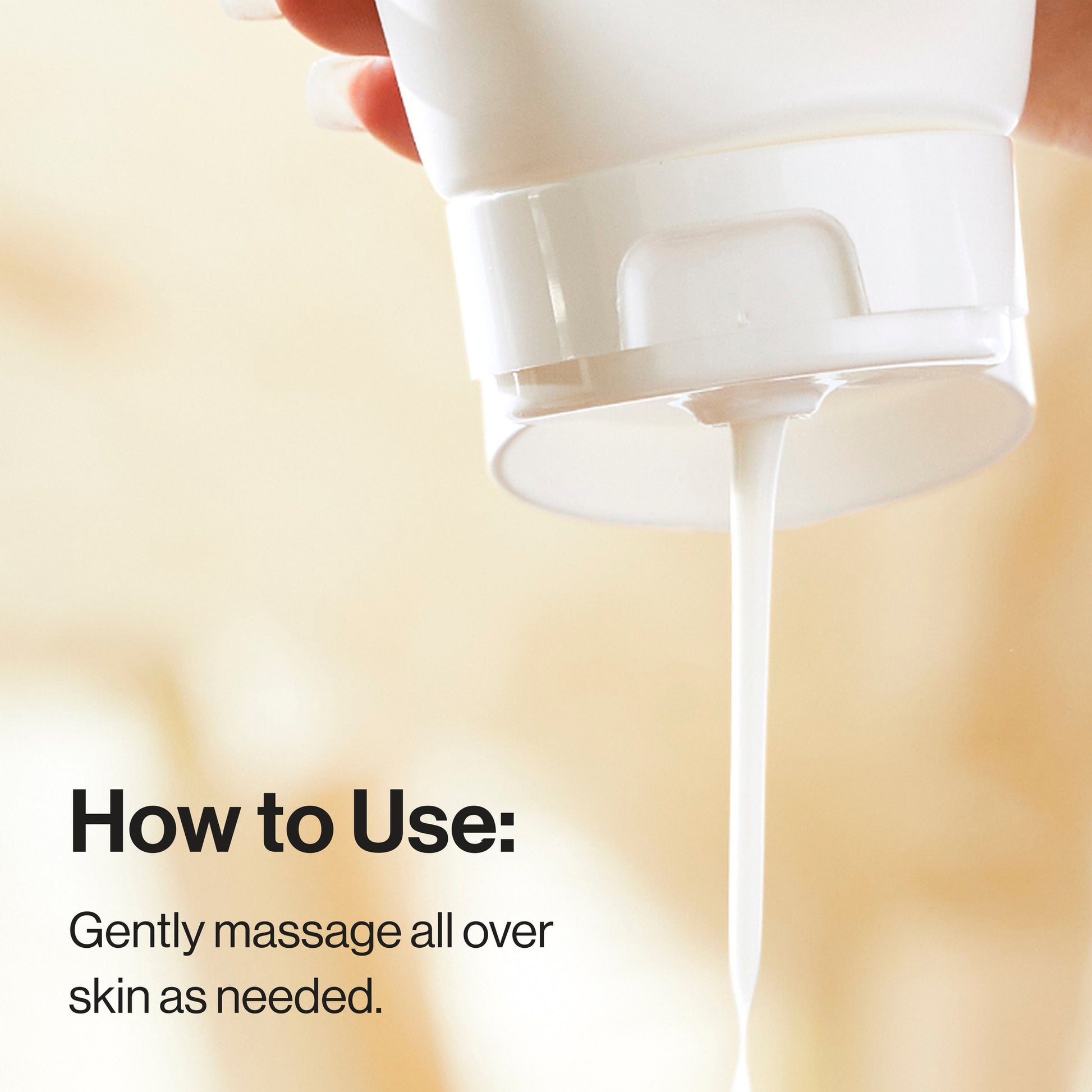 Hand holding a white bottle with a pump, dispensing a clear liquid onto skin.