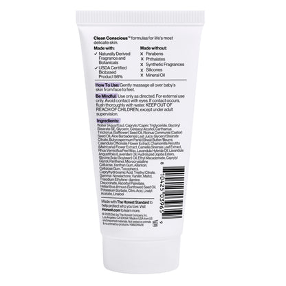 The back of a white tube of baby lotion, showing printed text with product details, ingredients, and a barcode on a plain white background.