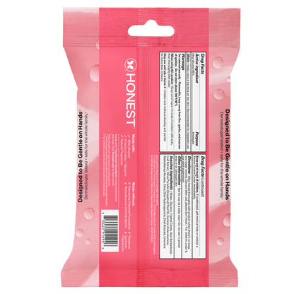The back of a pink Honest brand wet wipe pack, showing the product information panel, barcode, and text 'Designed to Be Gently on Hands'.