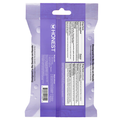The back of a purple and lavender Honest Brand hand sanitizer, showing product information, barcodes, and usage text on a white background.