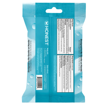 The back of a teal blue Honest brand wet wipe packet, showing the product ingredients, preparation instructions, and barcode on a plain white background.