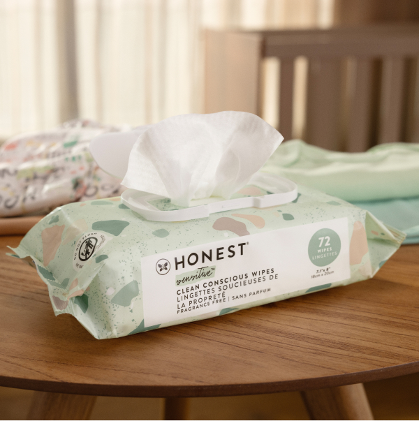 Mom using honest wipes with baby